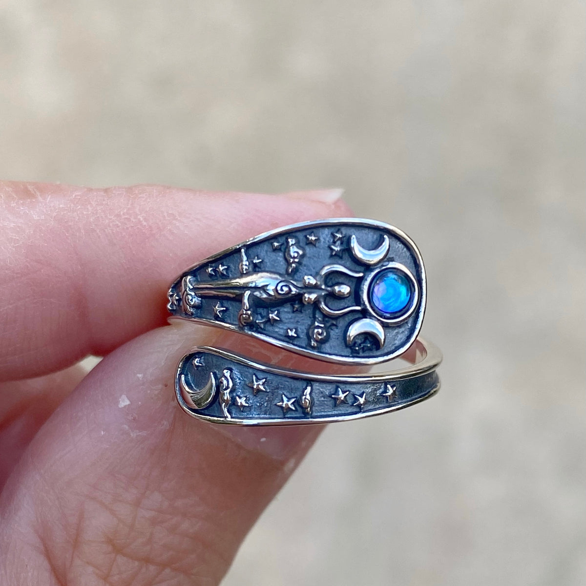 Sterling silver hecate Hekate hecate ring featuring celestial designs and a blue gemstone accent