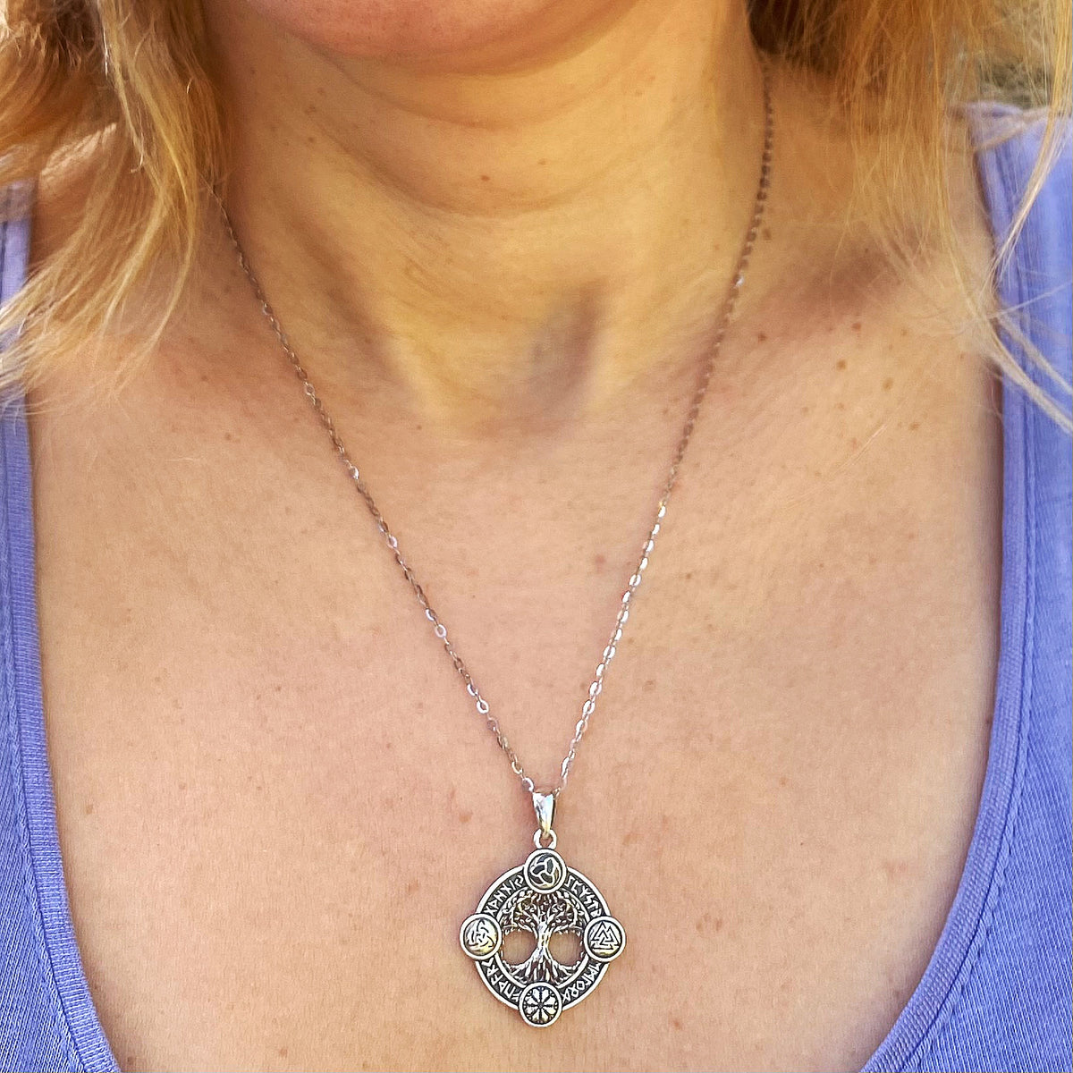 Sterling silver four norse symbols necklace worn on a person with a purple top by Miss Valkyrie