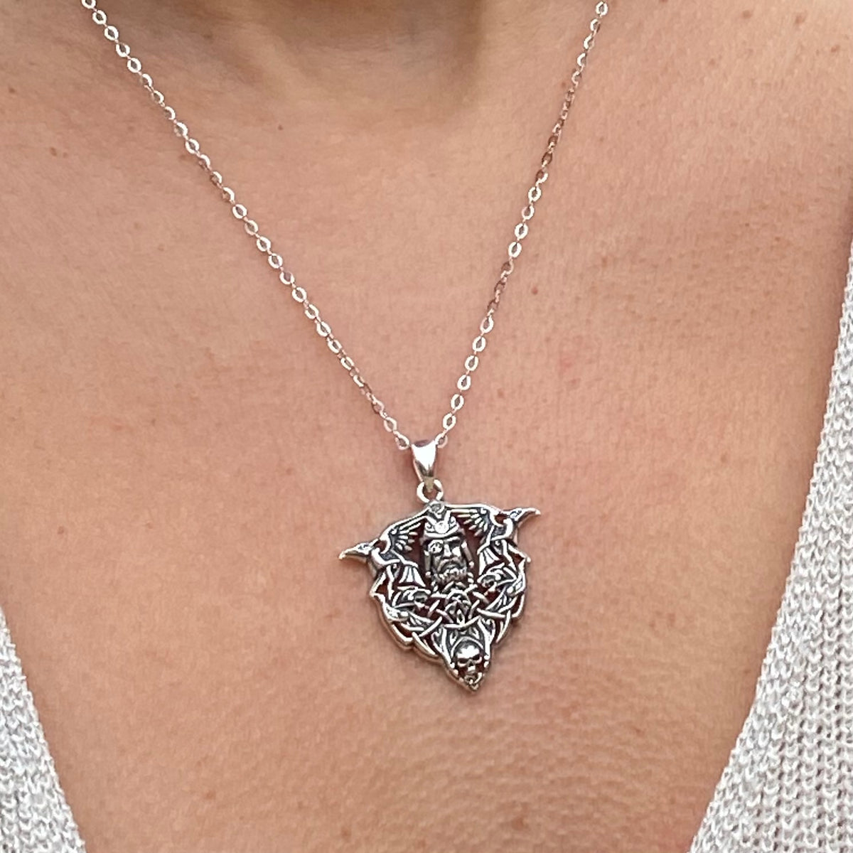 Sterling silver Odin necklace with intricate Norse design worn around neck by Miss Valkyrie