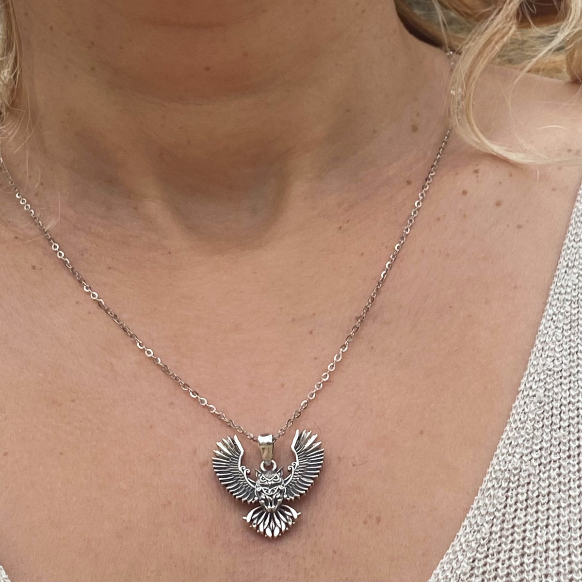 Miss Valkyrie sterling silver owl necklace with detailed wings worn on neck