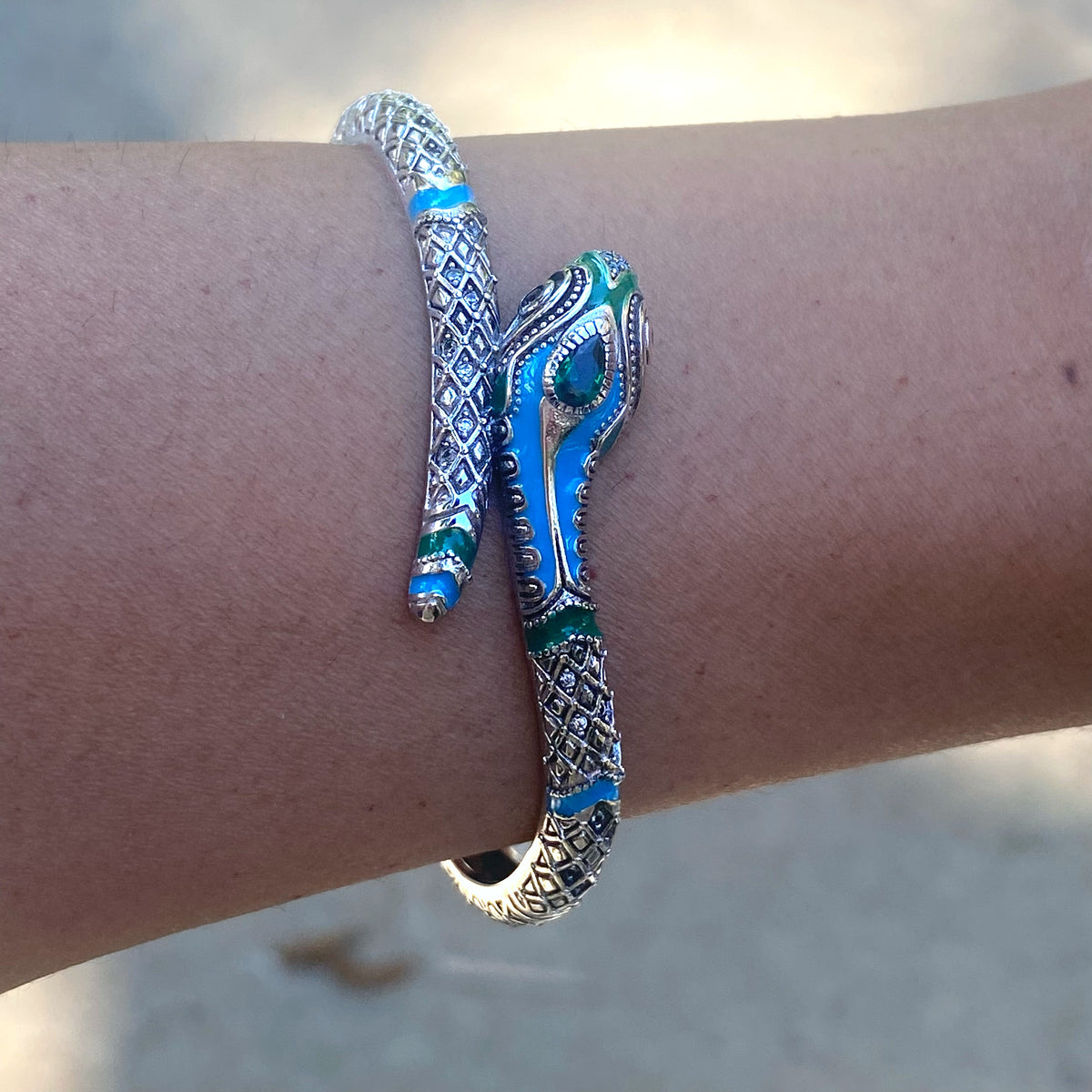 Sterling silver snake bracelet girl designed with blue and green enamel details by Miss Valkyrie