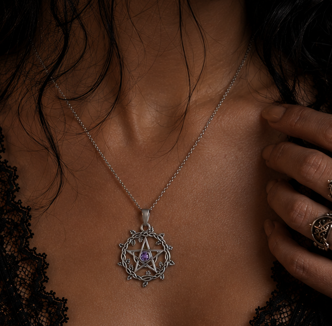 Elegant silver pentagram necklace with a purple gemstone, worn by a woman with dark hair