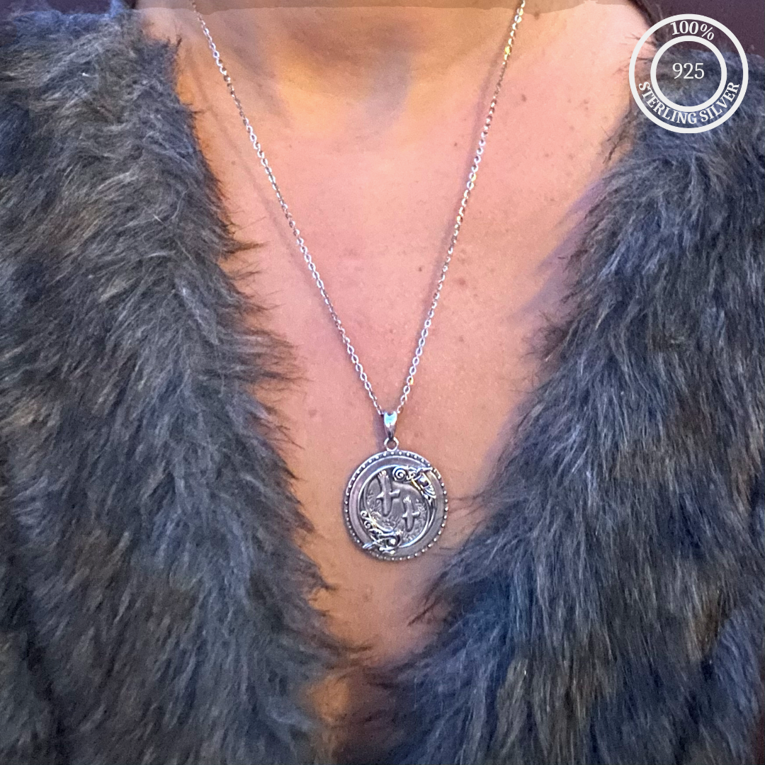 Miss Valkyrie raven necklace Sterling silver pendant on chain worn with a fur coat